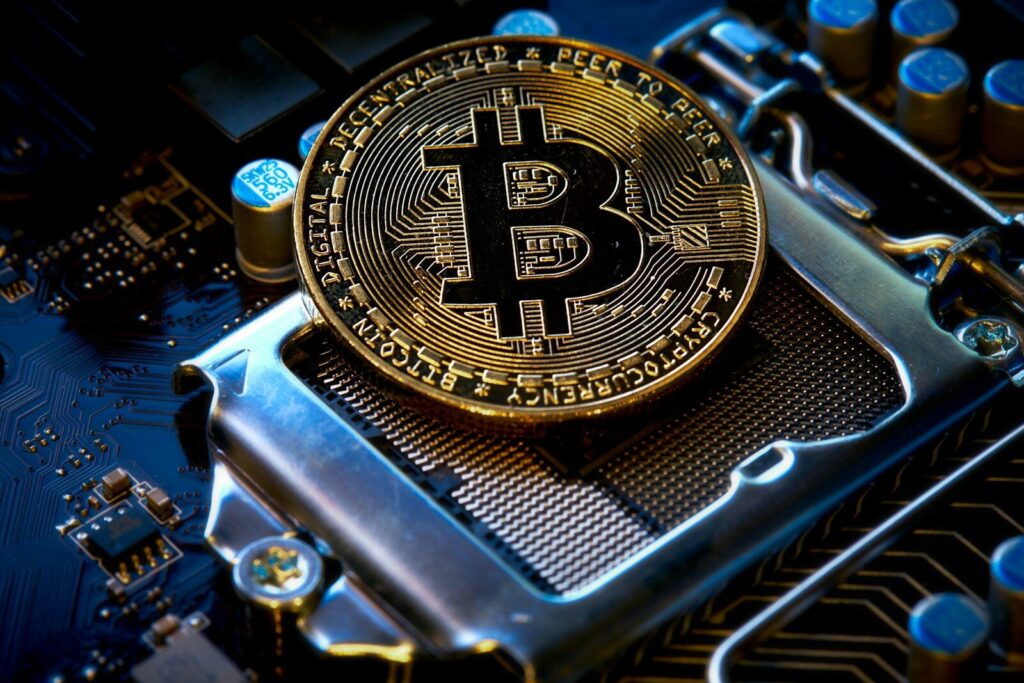 a bitcoin sitting on top of a motherboard